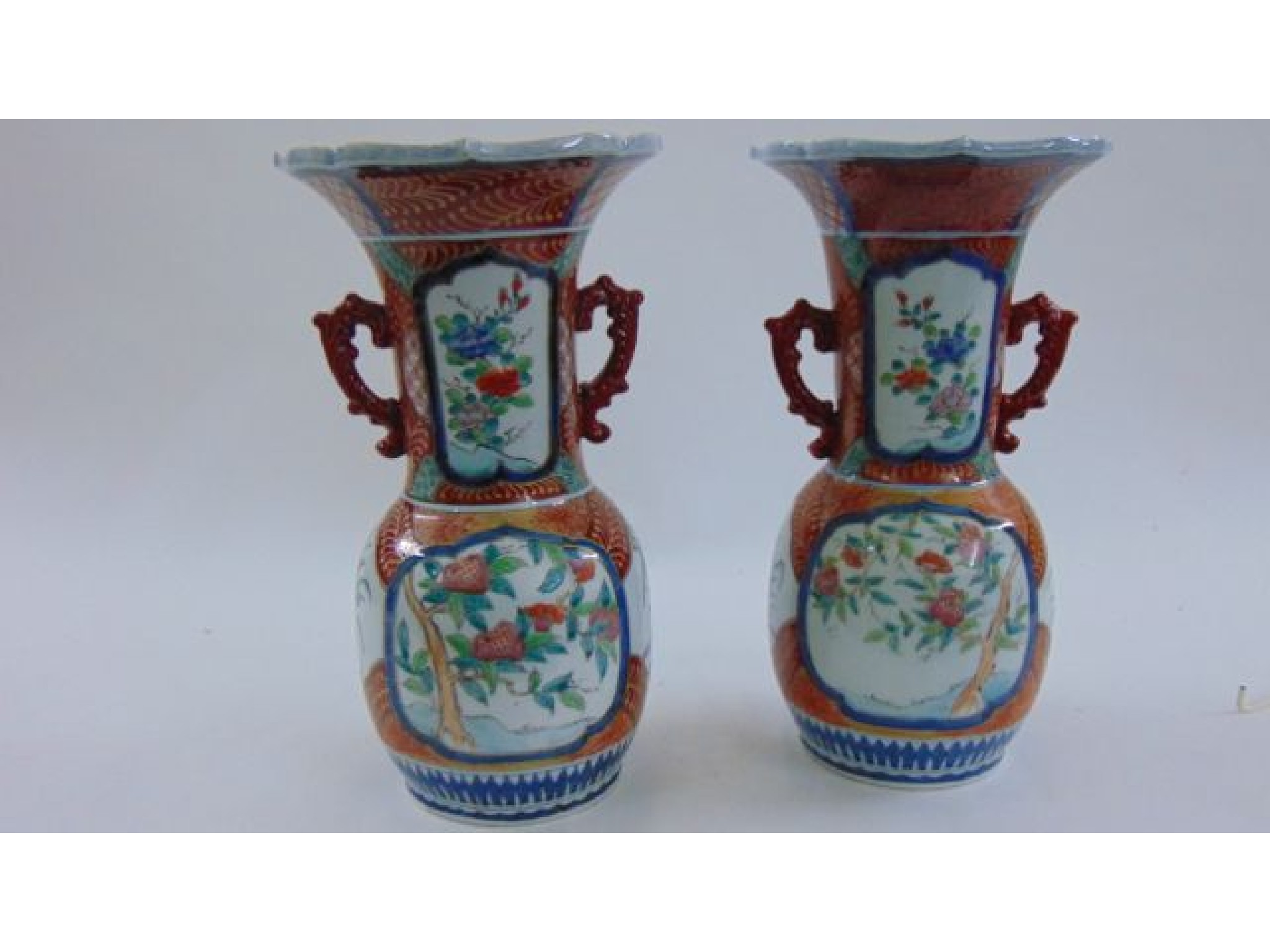 Appraisal: A pair of th century oriental two handled vases with