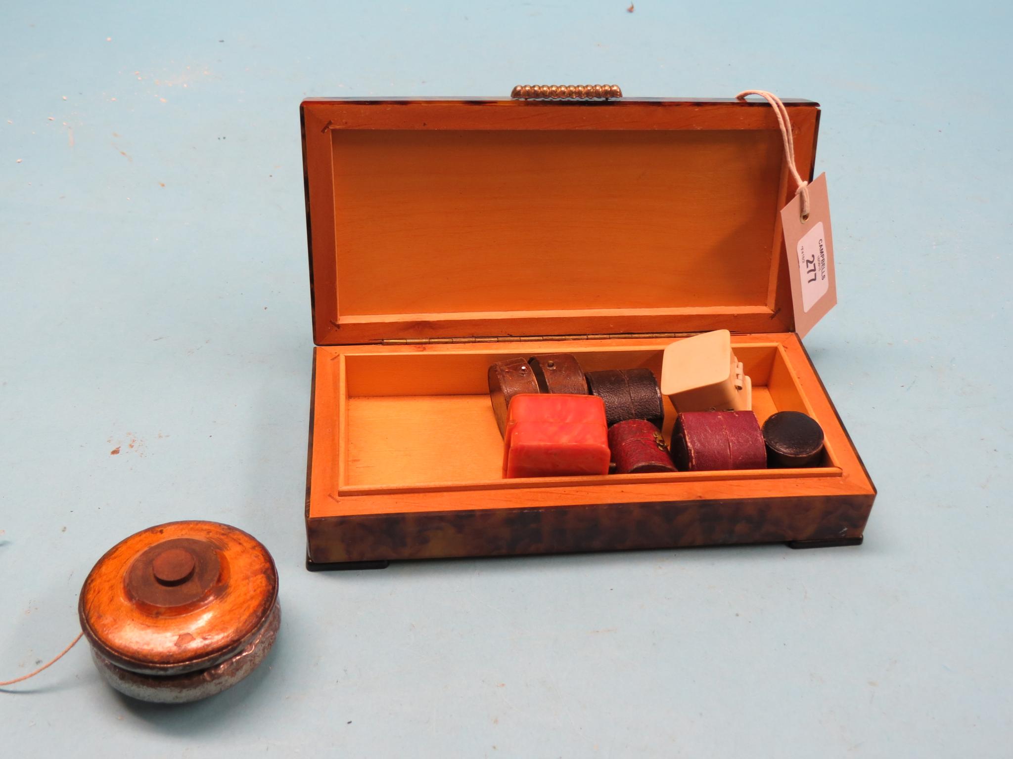 Appraisal: An early Yoyo wood and metal-bound together with seven various