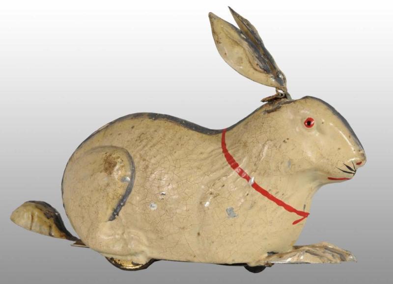 Appraisal: Tin Hand-Painted Rabbit Wind-Up Toy Description German Working Early spoked