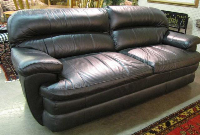 Appraisal: Contemporary black leather sofa fixed cushions pub back on legs