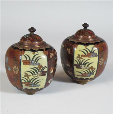 Appraisal: A pair of Japanese cloisonn enamel hexagonal vases and covers