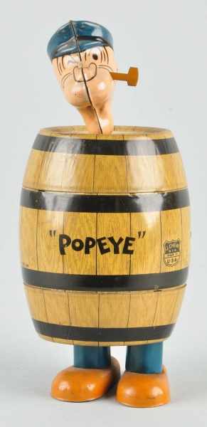 Appraisal: Tin Chein Popeye in Barrel Wind-Up Toy Description American Working