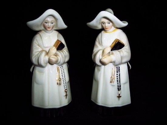 Appraisal: Two Royal Worcester snuffers modelled as nuns cm high