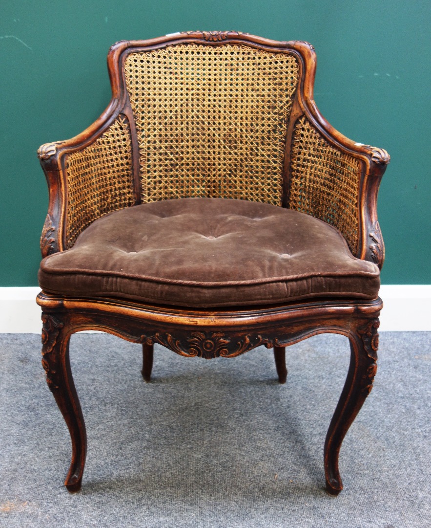 Appraisal: A Louis XV stained and carved beech framed tub back