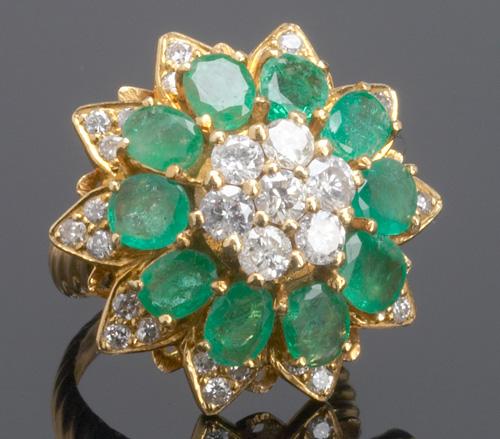 Appraisal: Emerald and diamond cluster ring in k yg ca Floriform