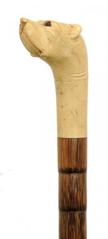 Appraisal: A BONE-HANDLED BAMBOO WALKING CANE the handle carved in the