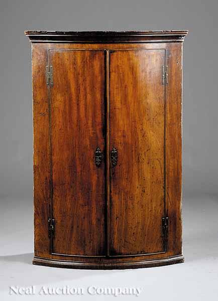 Appraisal: A Georgian Mahogany Bow-Front Hanging Corner Cupboard late th c