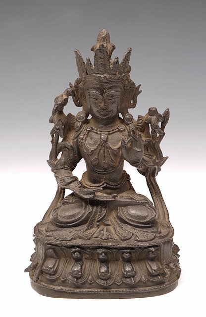 Appraisal: A CHINESE CAST METAL BUDDHA with hand raised on a