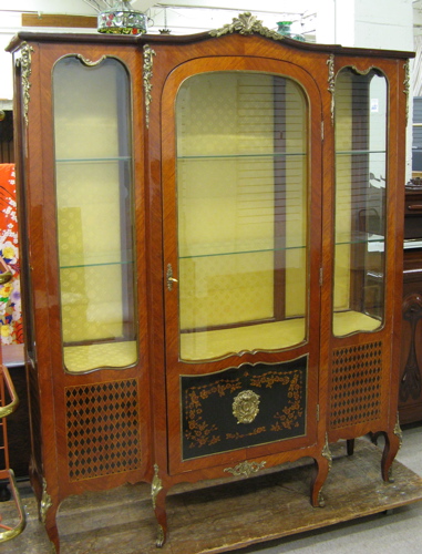 Appraisal: LOUIS XV STYLE BREAKFRONT CHINA DISPLAY CABINET of kingwood and