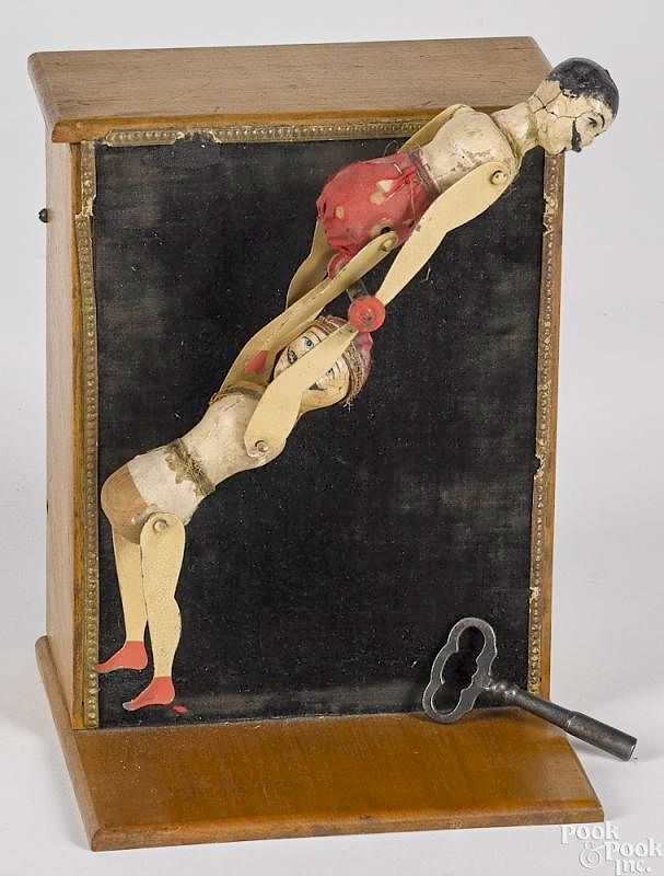 Appraisal: American clockwork double Acrobat toy American clockwork double Acrobat toy