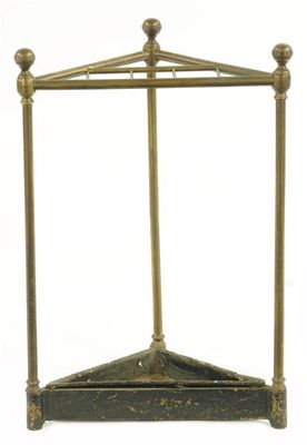 Appraisal: A turned brass and iron corner stickstand the base with