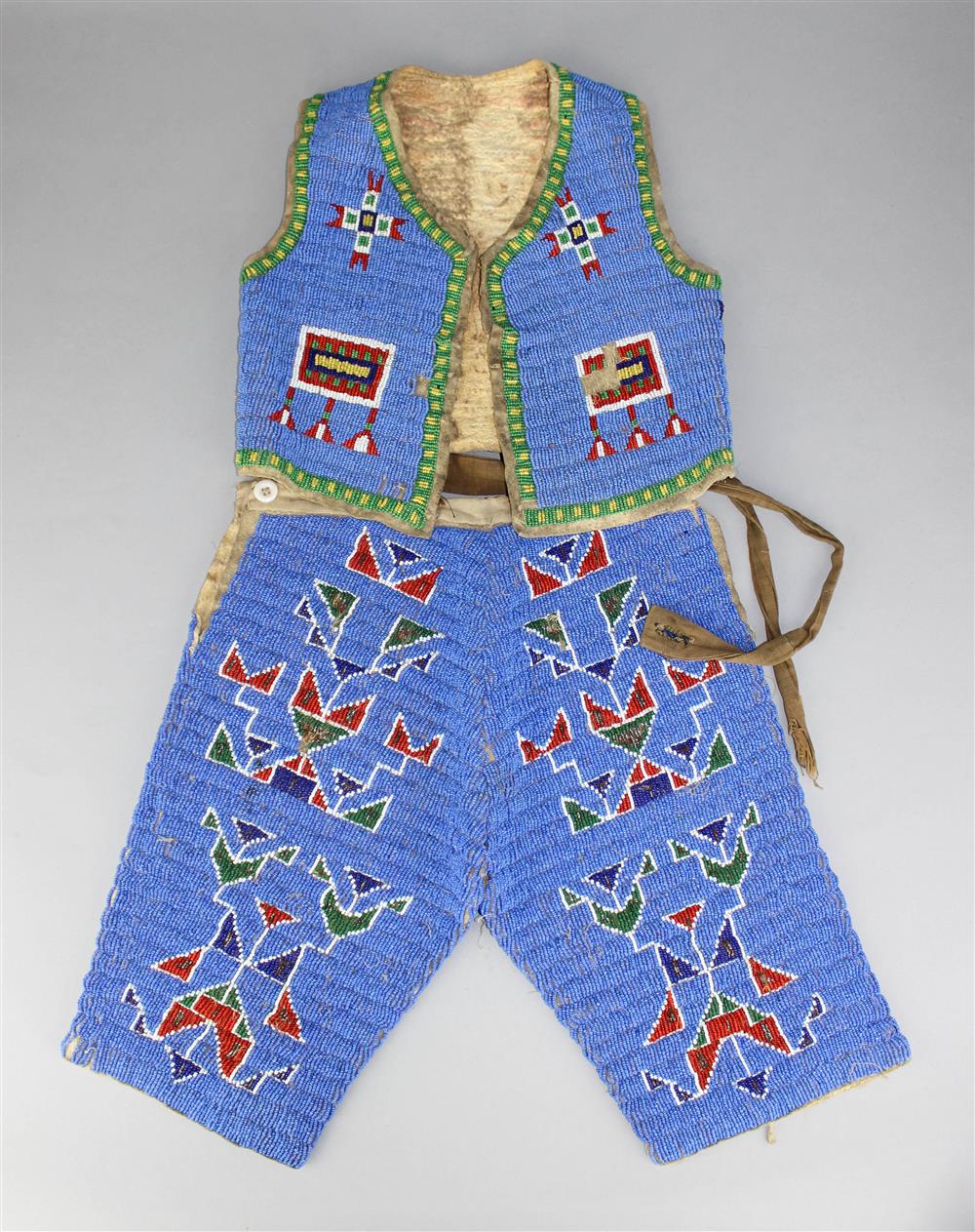 Appraisal: PLAINS BEADED HIDE CHILD'S OUTFIT LAKOTA Reservation period vest and