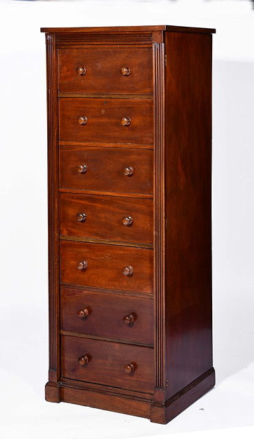 Appraisal: A VICTORIAN MAHOGANY WELLINGTON CHEST with six drawers with turned