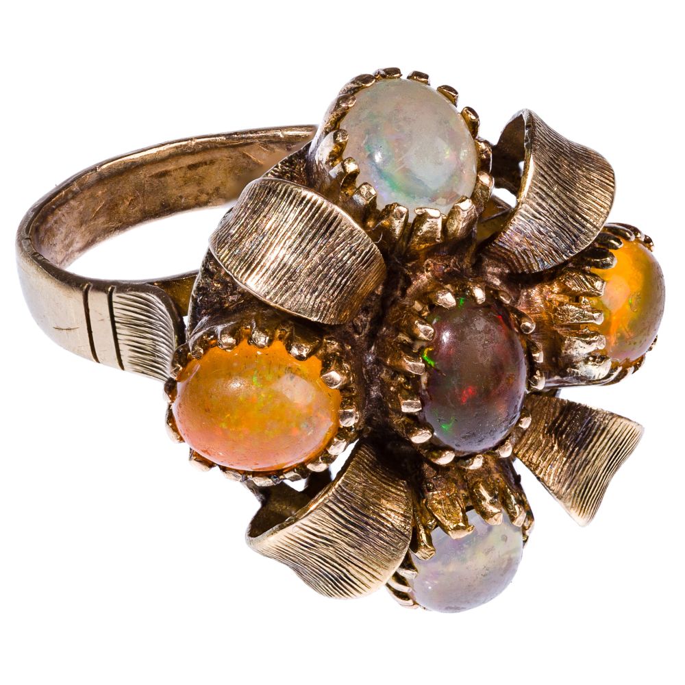 Appraisal: K YELLOW GOLD AND OPAL RINGDome style in flower motif