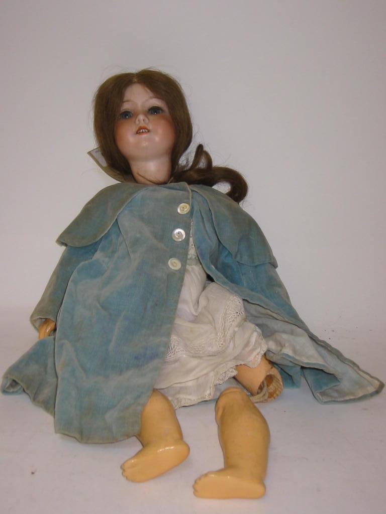 Appraisal: An Armand Marseille bisque head girl doll with blue glass