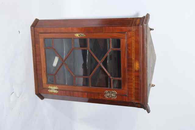 Appraisal: A GEORGIAN HANGING MAHOGANY CORNER CABINET with glazed door wide