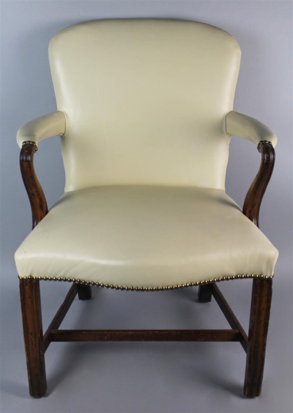 Appraisal: GEORGIAN CARVED MAHOGANY ARMCHAIR with arched curved back above a