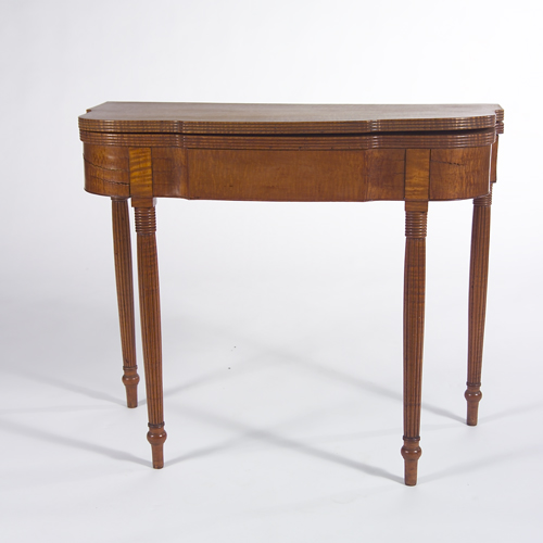 Appraisal: American tiger maple card table th c with reeded legs