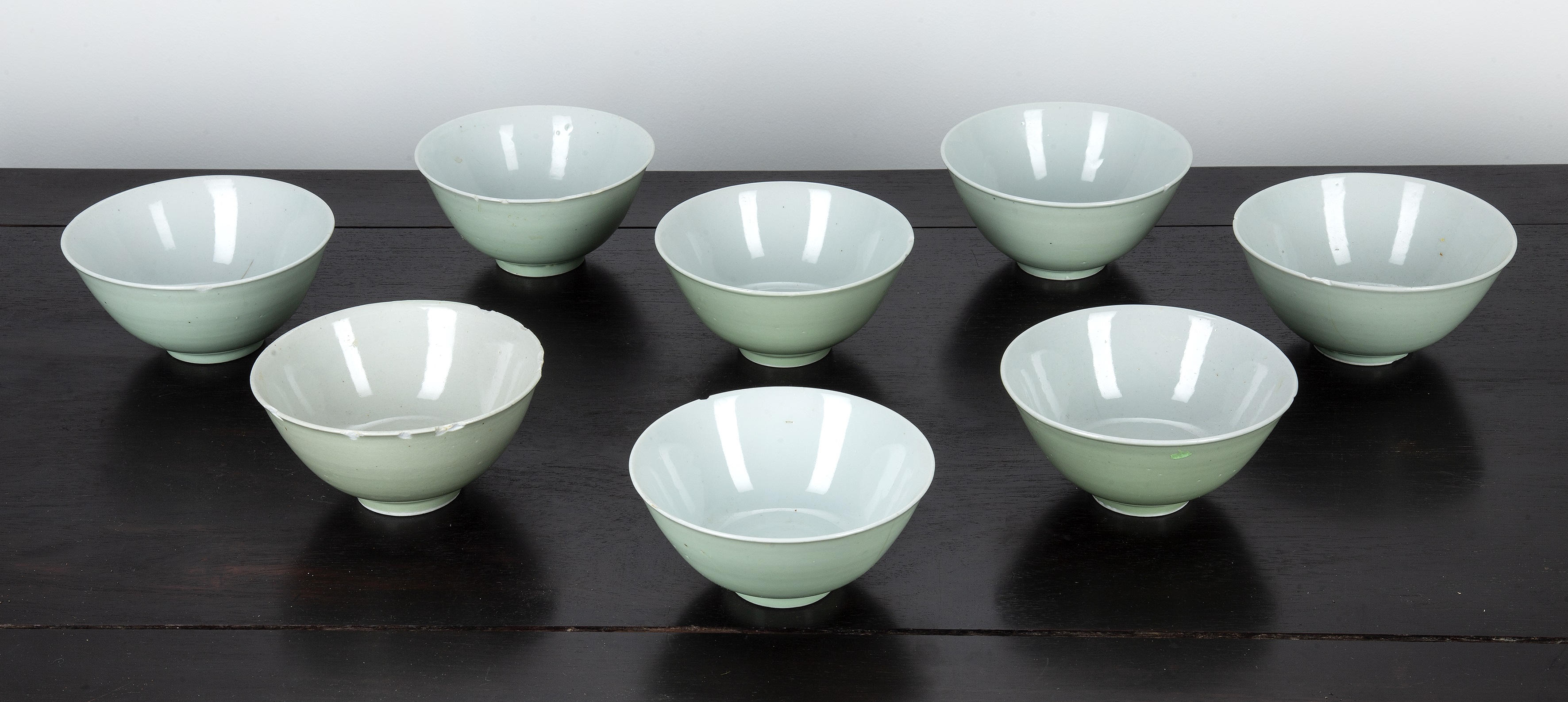 Appraisal: Group of eight celadon bowls Chinese th Century decorated with