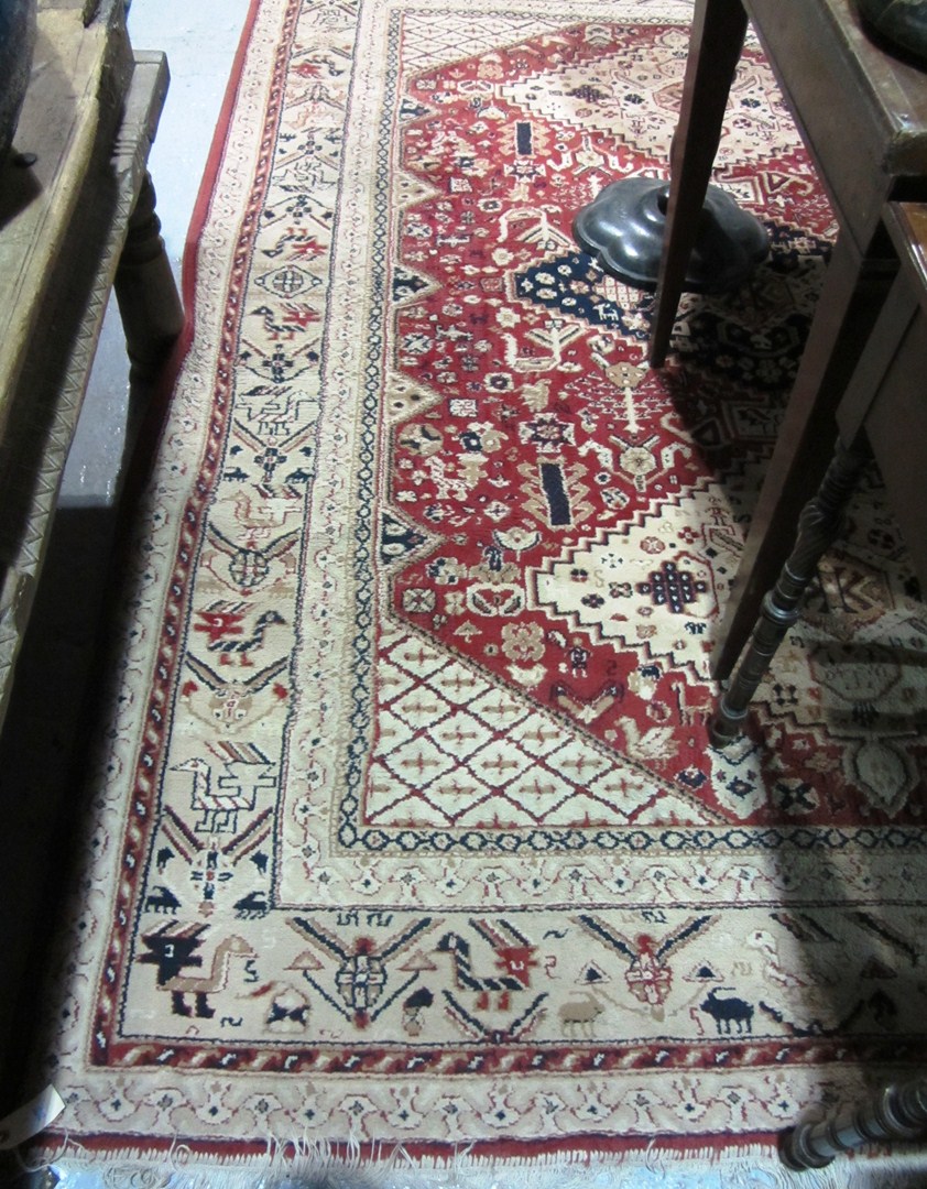 Appraisal: A th century cream and red rug