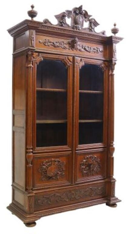 Appraisal: French carved oak library bookcase th c scrolling split pediment