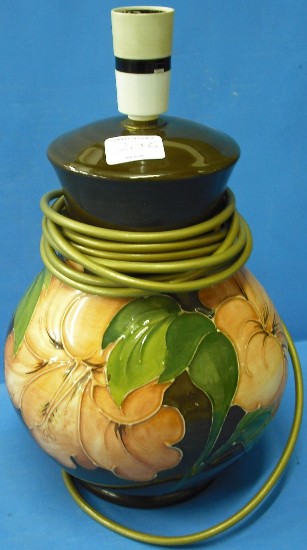 Appraisal: Moorcroft Lampbase decorated with Hibiscus on brown ground height cm