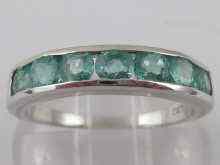 Appraisal: A white metal tests silver seven stone emerald ring