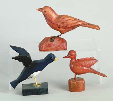 Appraisal: THREE CARVED WOOD BIRDS One is painted blue Other two