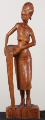 Appraisal: Carved wooden sculpture of a young woman pouring water from