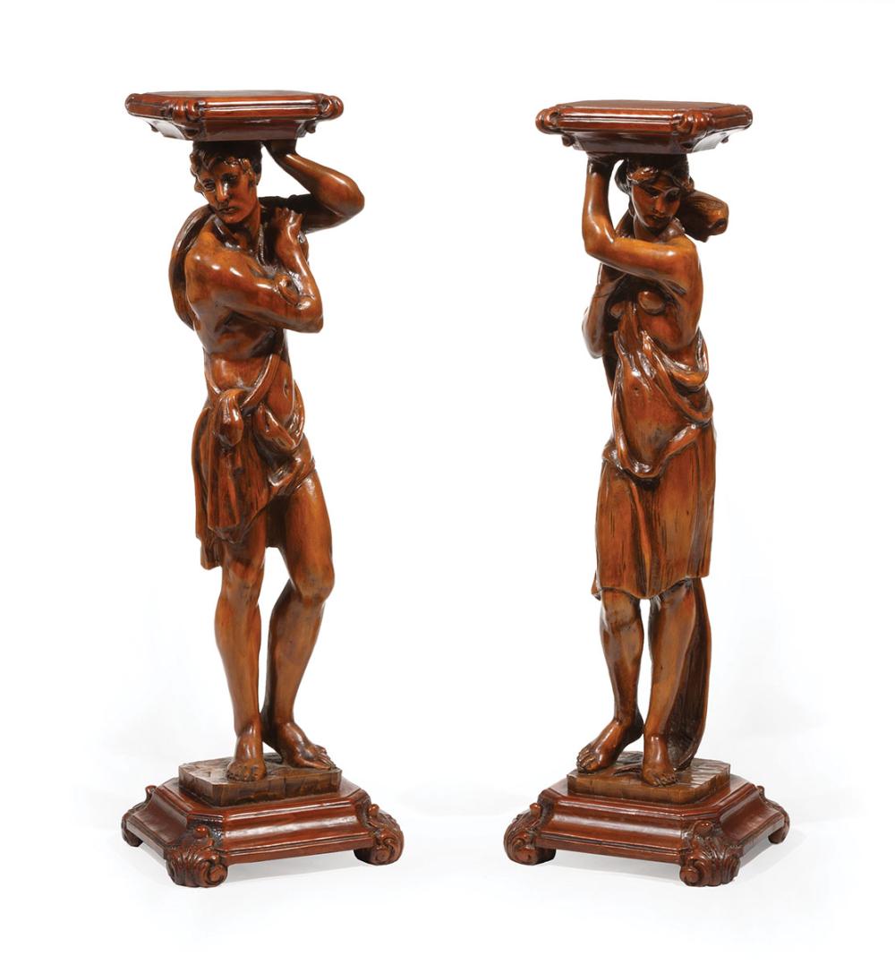 Appraisal: Pair of Continental Carved Walnut Figural Pedestals opposing classicaly drapped