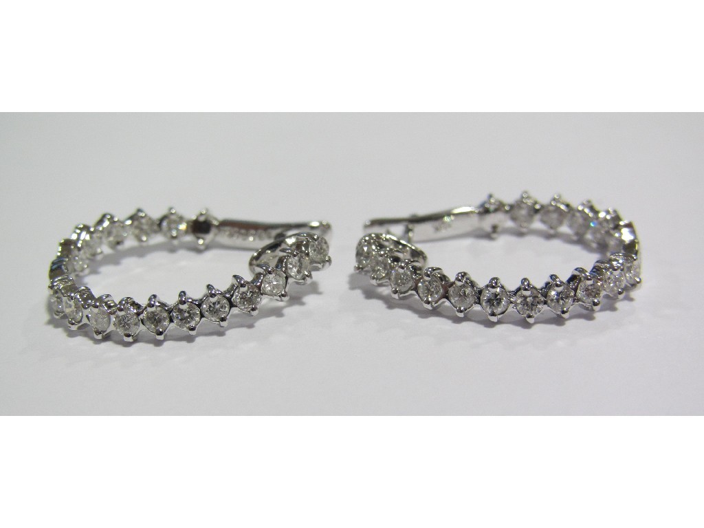 Appraisal: Eighteen carat white gold diamond set hoop earrings