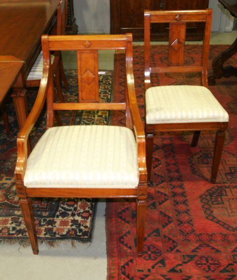 Appraisal: A set of eight French fruitwood dining chairs including two