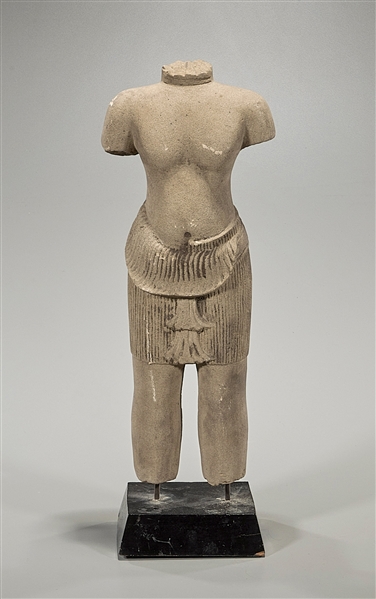 Appraisal: Khmer armless sandstone standing male deity possibly th C knee-length