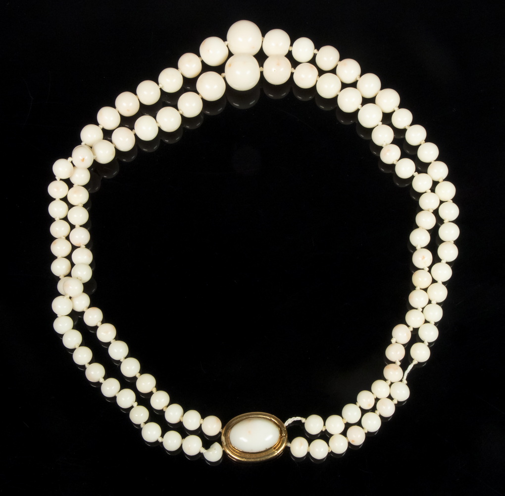 Appraisal: DOUBLE STRAND OF WHITE CORAL GRADUATED BEADS WITH K GOLD