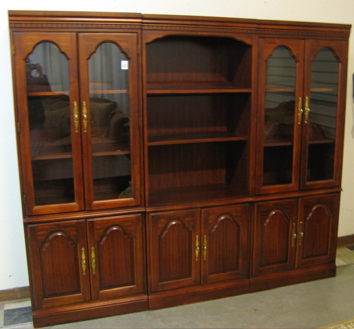 Appraisal: A THREE-SECTION CURIO DISPLAY CABINET American c each unit with