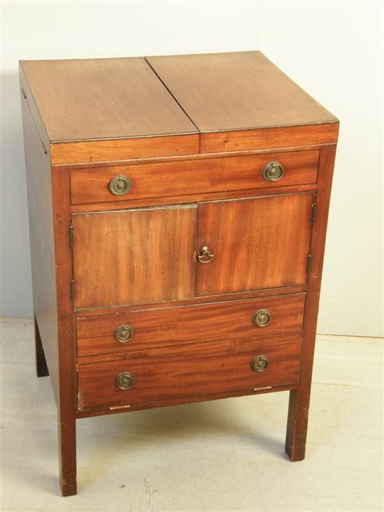 Appraisal: George III mahogany enclosed washstand with hinged top above a