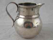 Appraisal: A silver cream jug with sparrow beak lip Birmingham wt