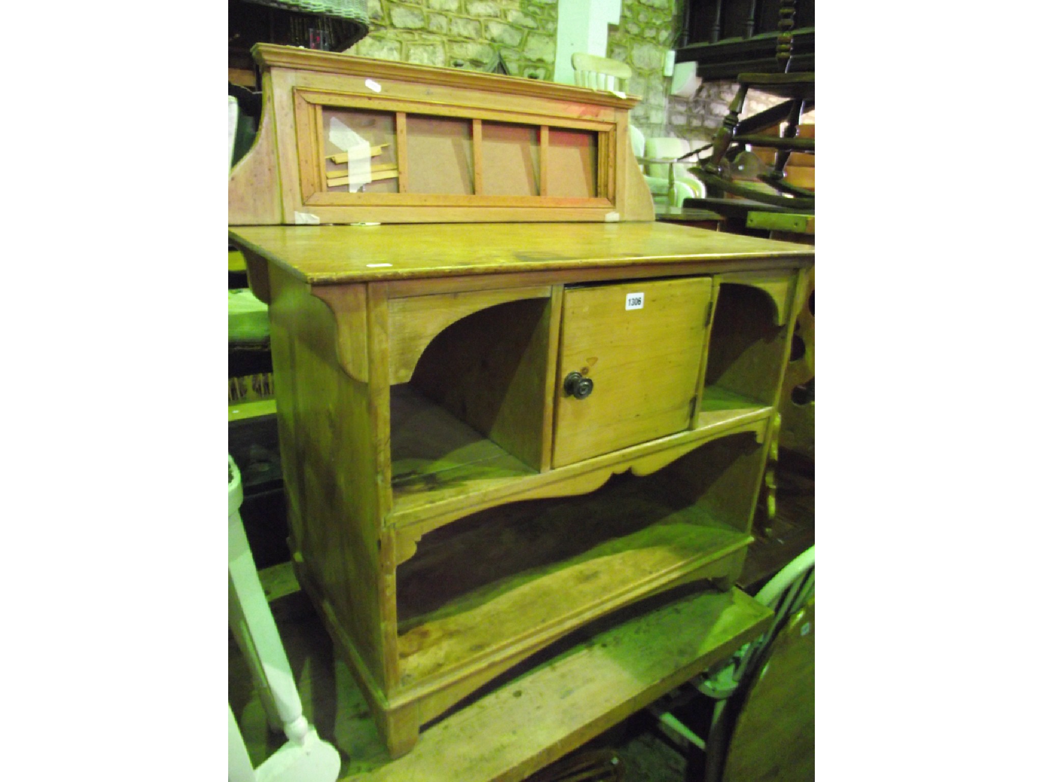 Appraisal: An unusual stripped and waxed pine washstand with central cupboard