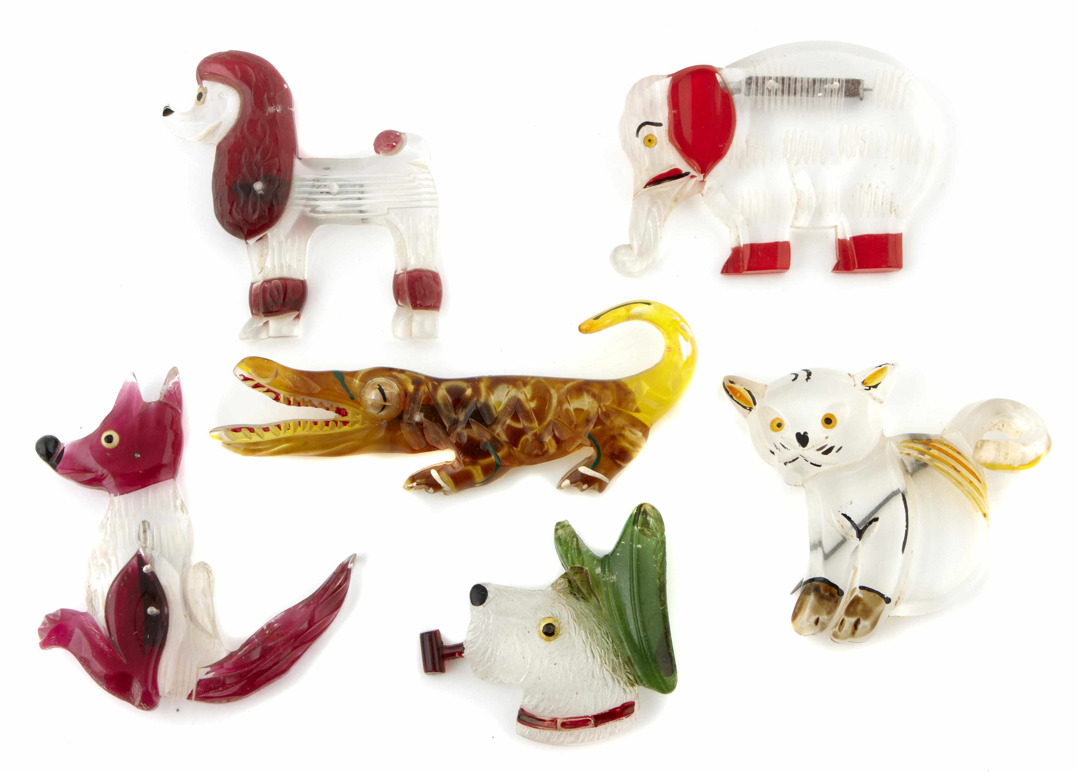 Appraisal: Six Lucite figural brooches two dogs elephant cat alligator and