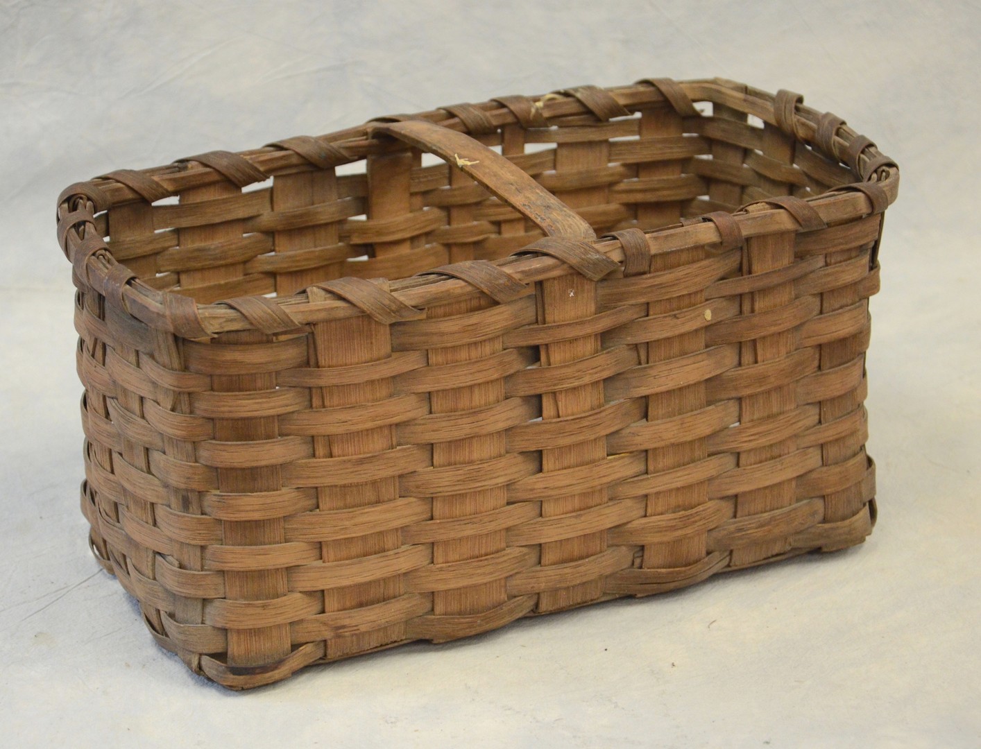 Appraisal: Flat stacking farm basket oak splint handle flush to rim