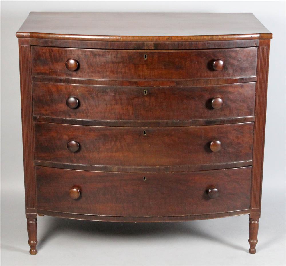 Appraisal: SHERATON BOWED CHERRY CHEST OF DRAWERS having a molded top