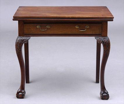 Appraisal: GEORGE II CARVED MAHOGANY GAMES TABLE The rectangular folding top