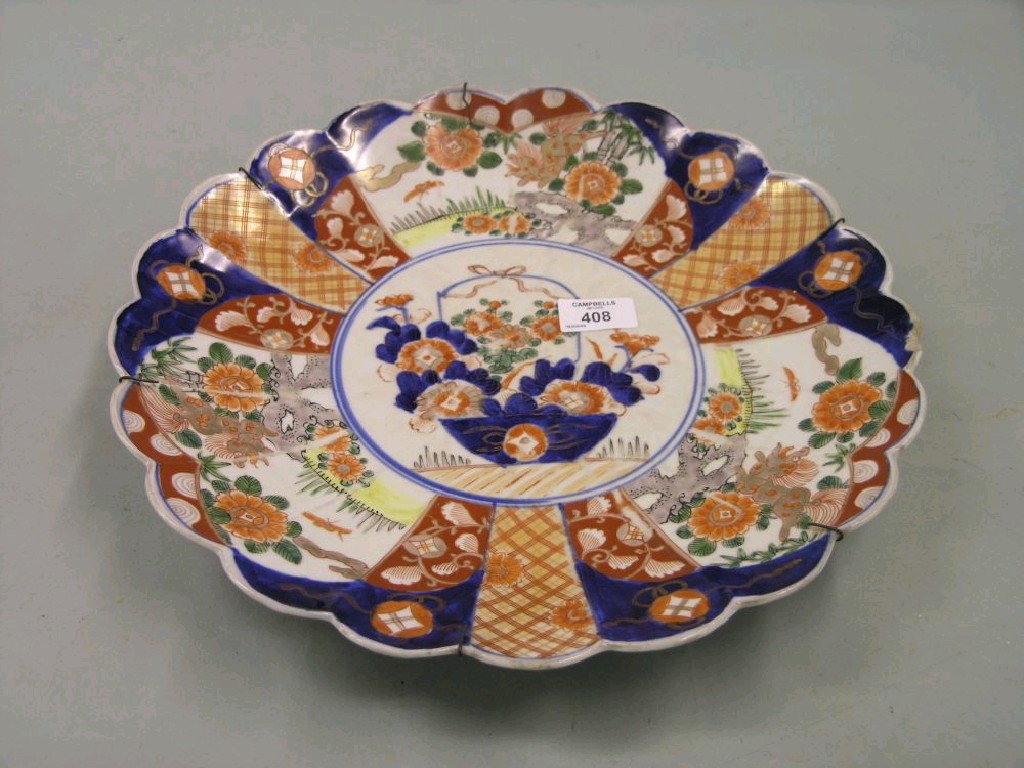 Appraisal: An Imari wall plate circular shape with lobed rim painted