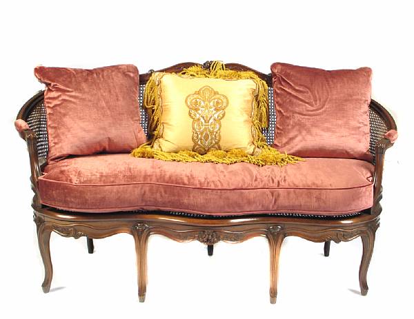 Appraisal: A Louis XV style walnut and cane settee height in