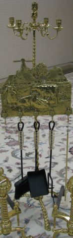 Appraisal: Decorative brass fireplace tool stand with four-branch candleholder three leg