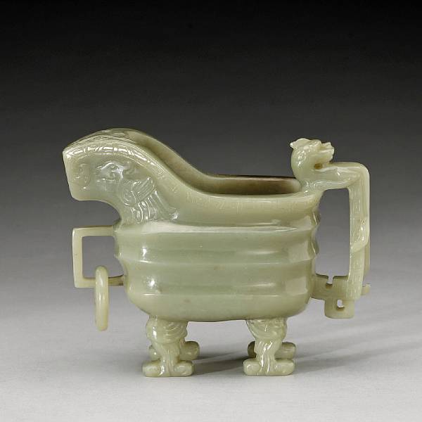 Appraisal: A pale green jade archaistic vessel Of yu form raised