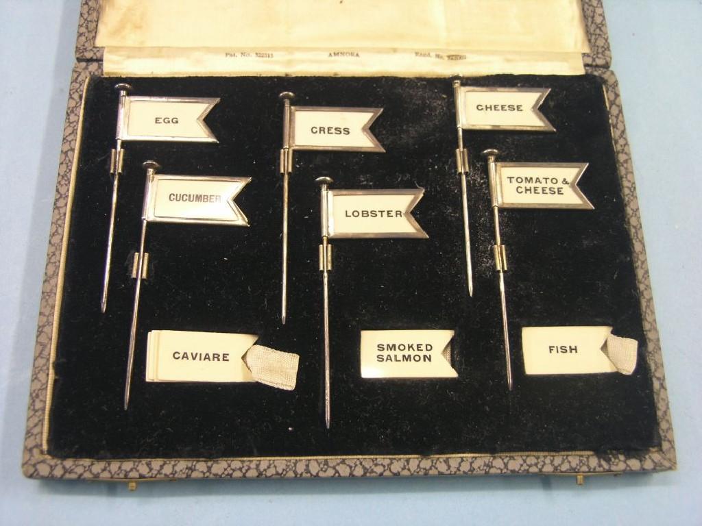 Appraisal: An unusual cased set of six silver plated sandwich labels