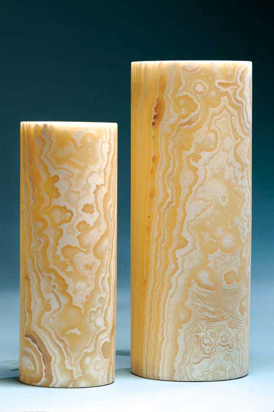 Appraisal: HANDSOME PAIR OF ONYX LAMPS Mexico Two matching cylindrical lamps