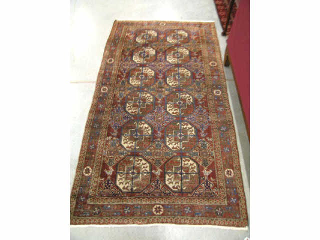 Appraisal: Turkman Persian Handmade Rug interesting geometric designs burgundy field '