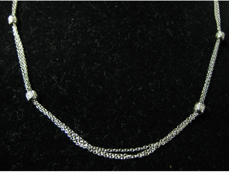 Appraisal: DIAMONDS BY THE YARD NECKLACE k white gold triple chain